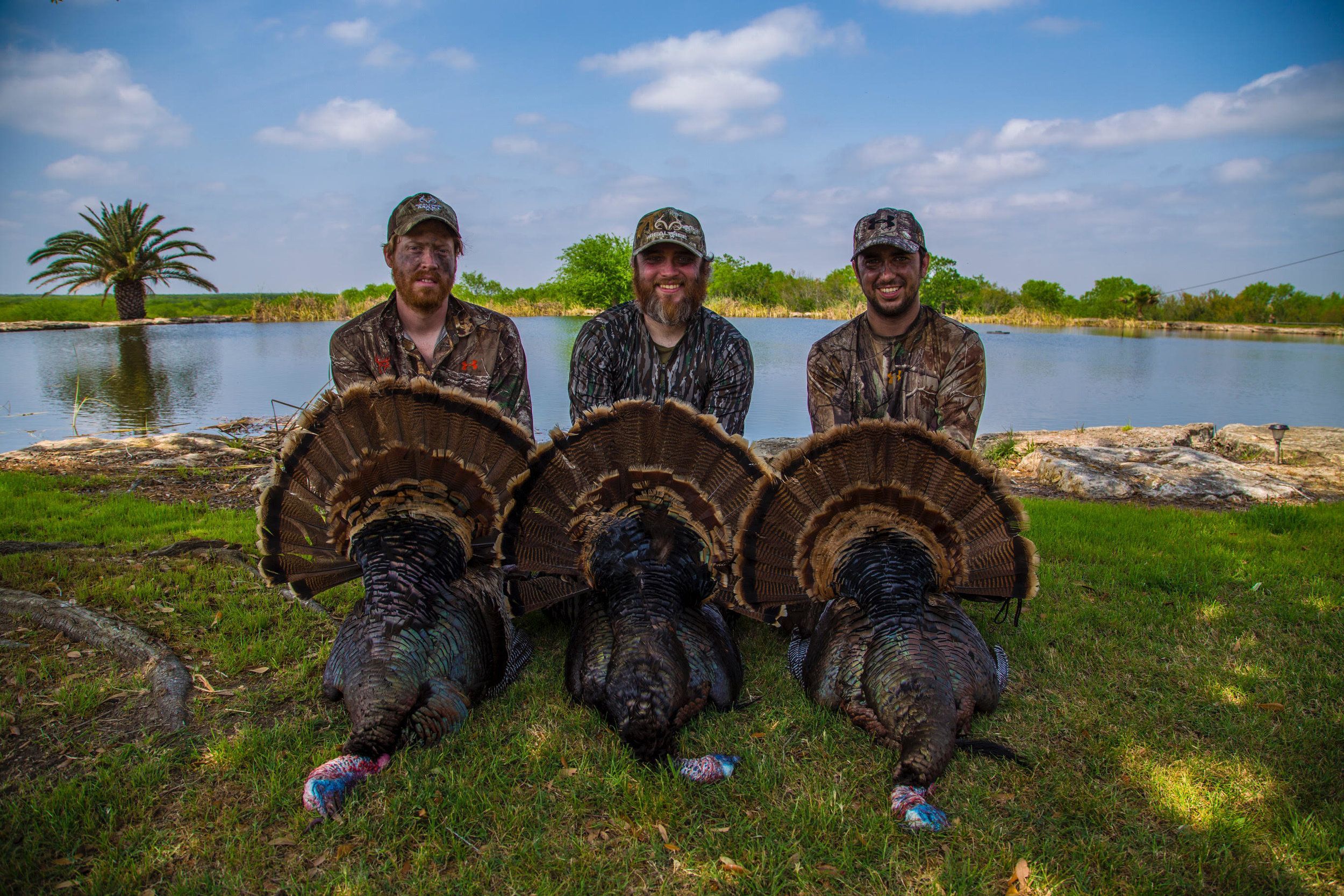 Jordan Summit and friends with turkeys after a successful turkey hunt.