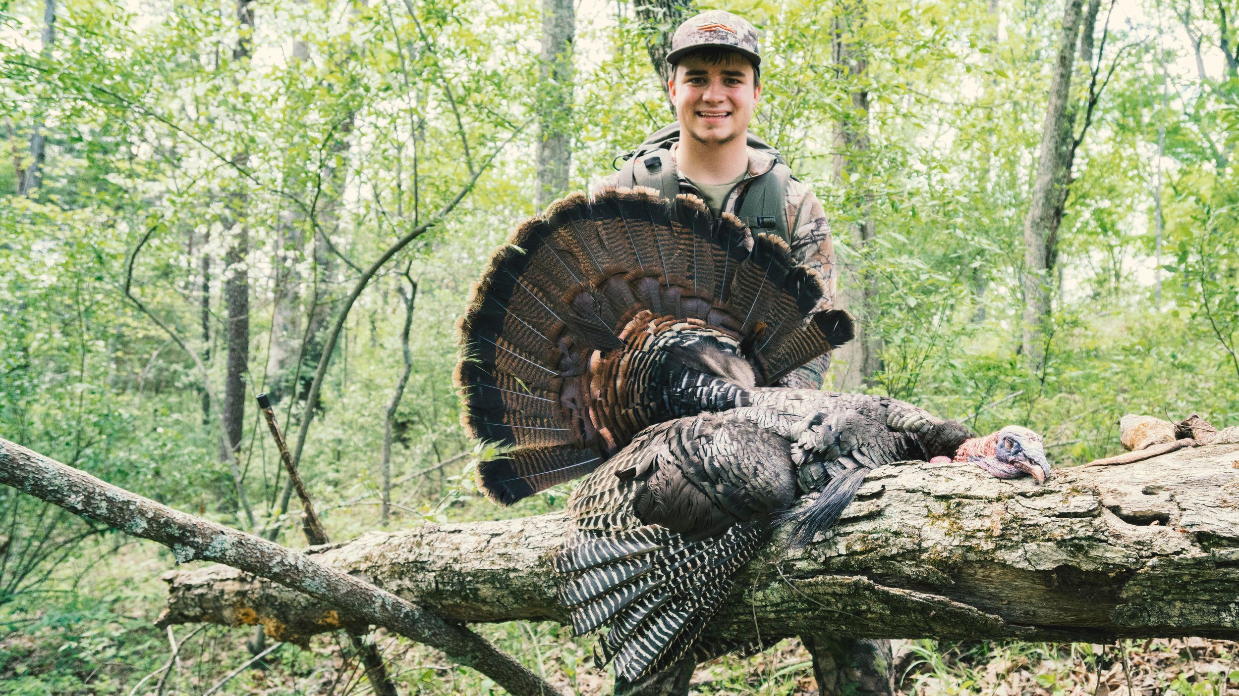 Kirk from The Untamed with a turkey after turkey hunting. 