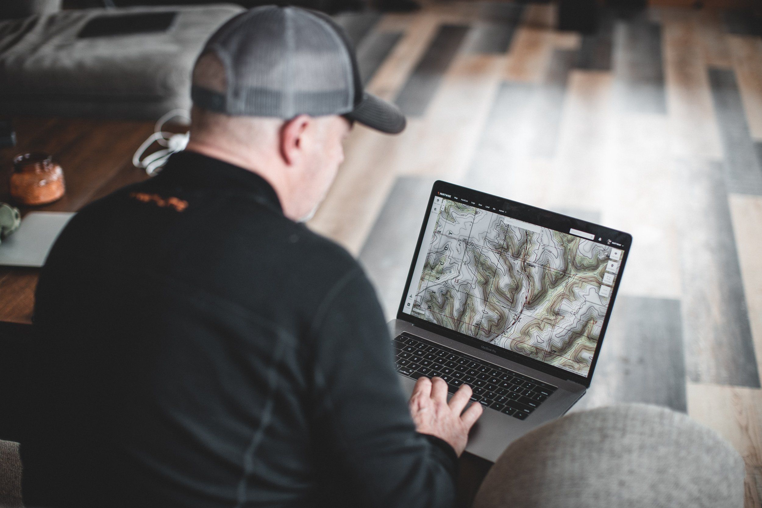 A hunter uses HuntWise map layers to plan a coyote hunt. 