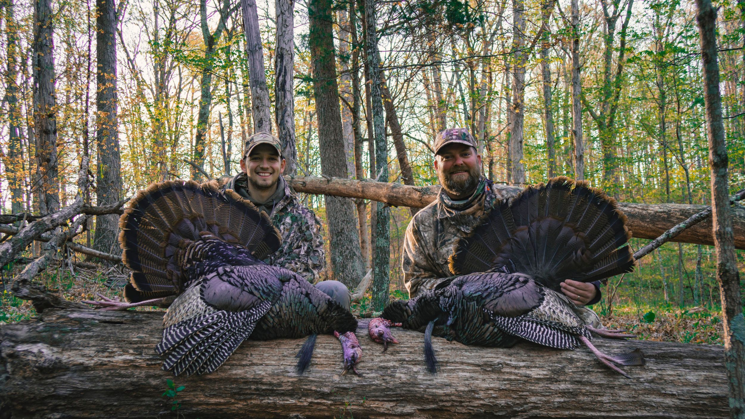 Trace and Josh from The Untamed with harvested birds after a turkey hunt. 